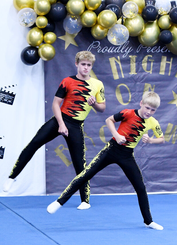 Liam Rasmussen and Brandon Lenauer (from left) perform their Level 7 Combined routine during the annual Mid-America Acro and Tumbling Team Recital back on Sunday, June 4 at the MAATT gymnasium.