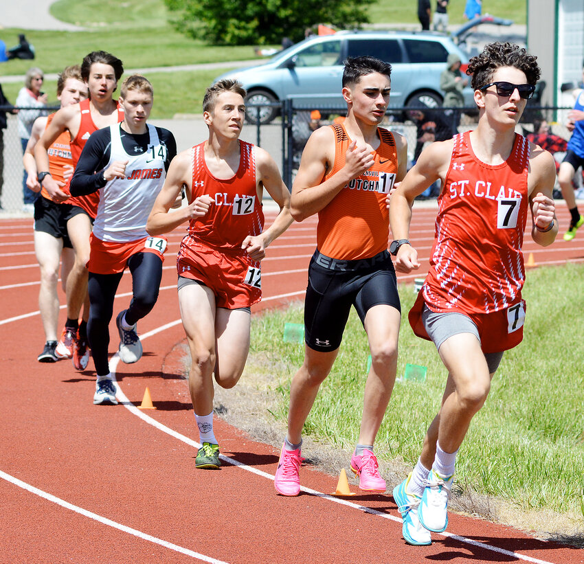 Lucas Morgan (second from right) races with a pack of runners during the varsity boys 1600-meter run held this past spring at the Four Rivers Conference (FRC) track meet hosted by New Haven High School.