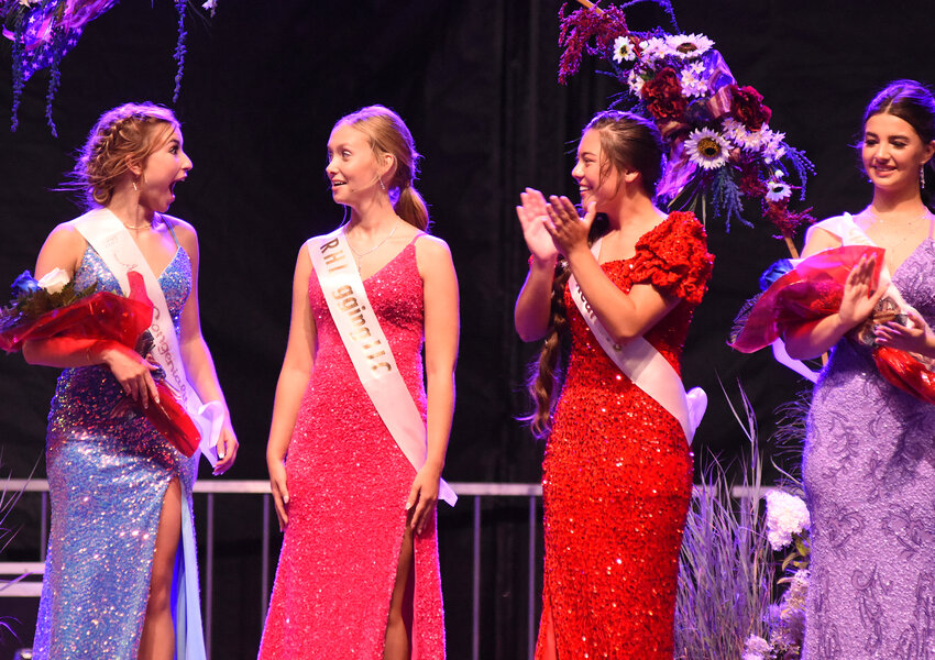 Ahna Rasmussen (second from left) reacts July 26 after hearing her name called as the 2023 Gasconade County Fair queen. Fellow contestants sharing the moment included (from left) Payton Harness, who moments earlier was named Miss Congeniality,  Audrey Quilacio, and Larissa Hoelmer, second runner-up. Rasmussen is the daughter of Bradley and Janelle Rasmussen of Gerald.  She will be a senior at Owensville High School in the fall.