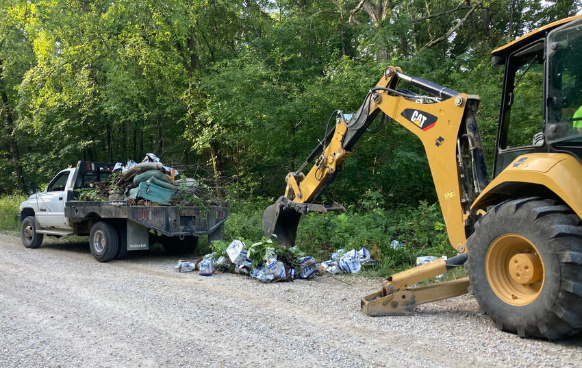 Road Two workers removed trash from Maries Road 405 in late July after a resident reported furniture and beer boxes had been left in the road.