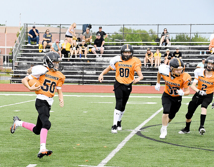 Charlie Katsov (left) returns an interception for Owensville&rsquo;s eighth-grade Dutchmen football team during their season-opening 30-0 loss to Sullivan Saturday at Dutchmen Field. Looking to block for Katsov&rsquo;s interception return (from left) were teammates Khai Krupp, Kristopher Carr and Brody Ridenhour.