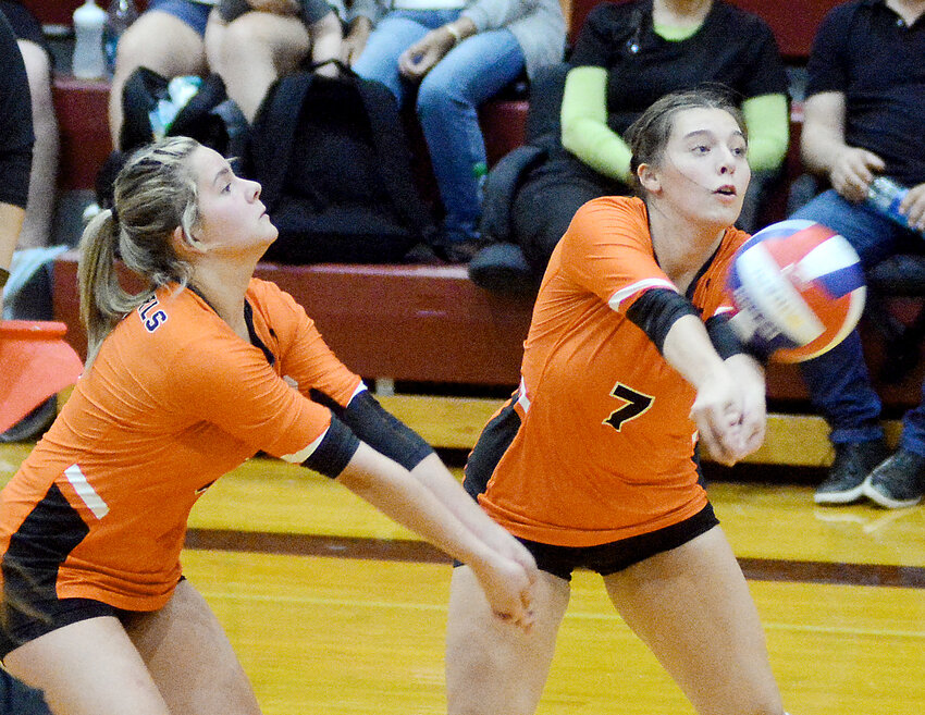 Makensy Pigg (right) passes the volleyball while McKenzy Echols (above, left) was in position to do the same during Owensville&rsquo;s five-set victory Thursday night in Osage County after Owensville won the C-team match in two sets and the junior varsity match in three sets.