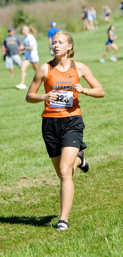 Hannah Gehlert competes in the varsity girls race Saturday at the New Haven Invitational Cross Country meet. Placing 10th, Gehlert was one of eight Owensville High School harriers to earn a medal in their respective races.