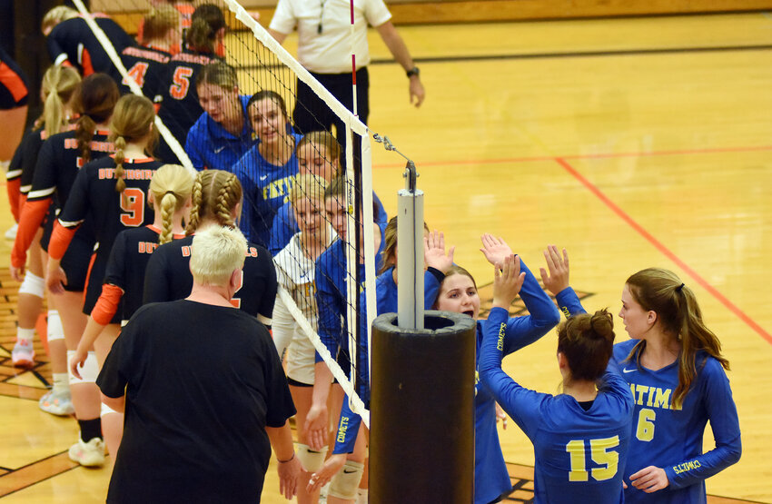 Fatima varsity volleyball players celebrate a win on Friday over Owensville, capping a week in which the Lady Comets won three straight matches.