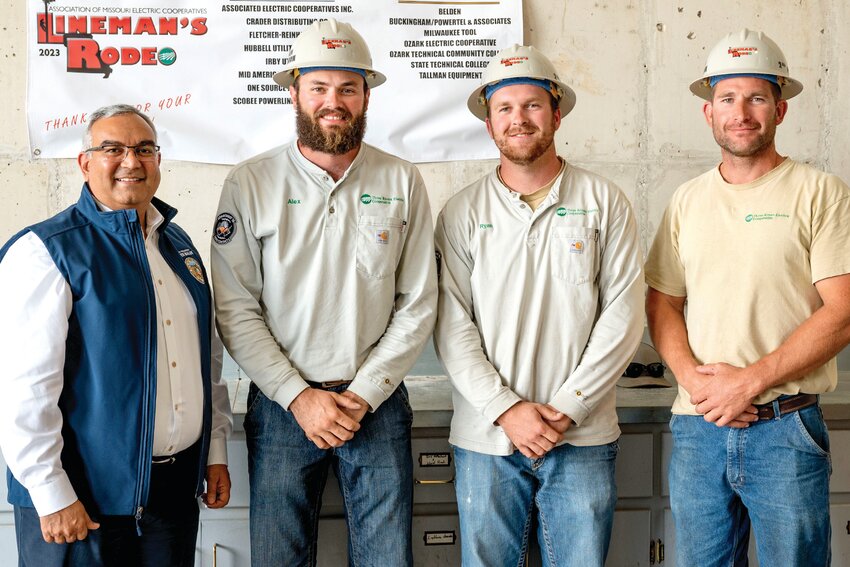 Missouri State Treasurer Vivek Malek, left, presents TREC linemen Alex Buschjost, Ryan Deeken, and Cory Kleffner, with their second-place hardhat trophies, at the sixth annual Lineman&rsquo;s Rodeo recently. In addition, they each received first-place honors in timed individual events.