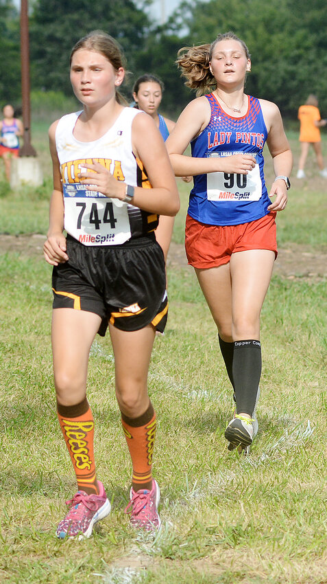 Kaylee Bresnahan (left) led Vienna Lady Eagle varsity cross country Thursday in the Belle Invitational Thursday at Belle City Park with a 17th-place finish good for a medal in the varsity girls race.