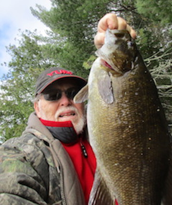 I never took a selfie before, but here is the one I attempted of the big smallmouth &mdash; 20 inches long, six pounds.