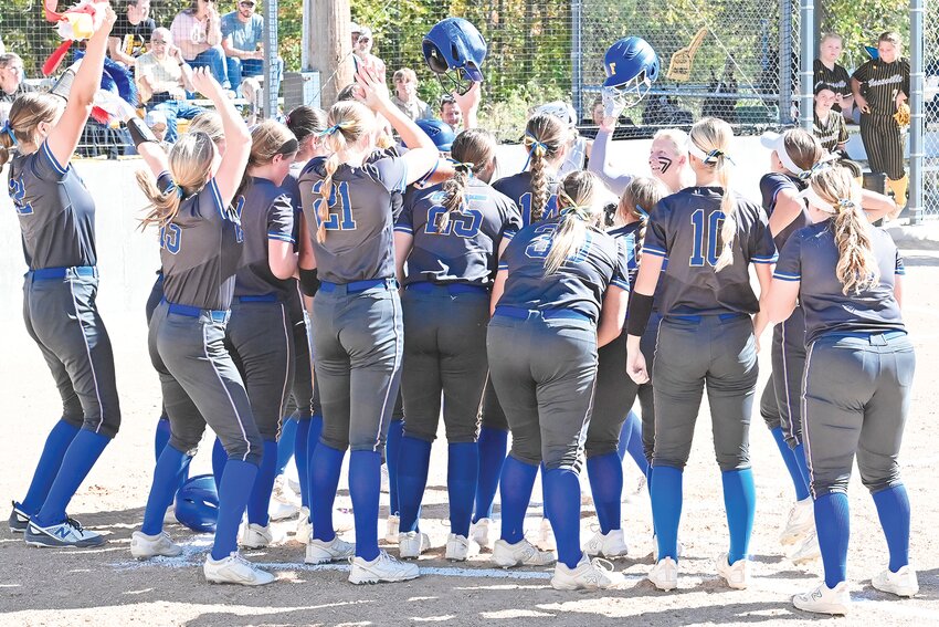 Fatima players celebrate Kenzy Woody&rsquo;s second home run during Saturday&rsquo;s Class 3 quarterfinal at Westphalia. The Lady Comets defeated Cassville 14-0 in five innings.
