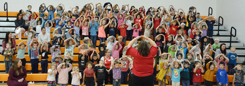 Owensville Elementary kind&shy;er&shy;&shy;&shy;garten and first-graders per&shy;&shy;form &ldquo;Thank You Soldiers&rdquo; during a Veterans Day assembly Friday afternoon.