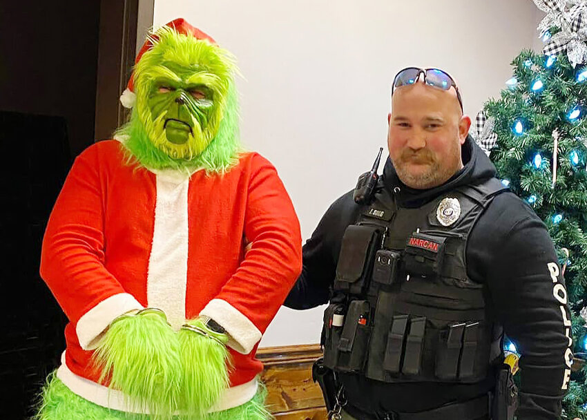 Belle Officer Erican Sugg was at the Belle-Bland Community Center on Nov. 25 for Rodney Durbin&rsquo;s Christmas auction where he made a staged arrest of the Grinch.