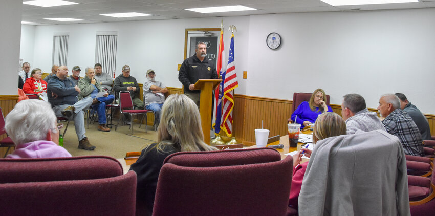 Maries County  Sheriff Chris Heitman (at podium) addressed the Belle Board of Aldermen on Dec. 13 regarding comments Mayor Daryl White, Jr., made in the paper last week about a local police officer who was under investigation when he was hired. Heitman played an audio recording for the board and citizens of a meeting between White and Chief Deputy Scott John around late October, early November 2022. White said in his own research he learned the officer was under investigation.