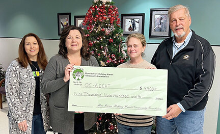 The Three Rivers Helping Hands Community Foundation presents a check to the Osage County Anti-Drug Community Action Team (OC-ADCAT) for a teen mental health program. Pictured from left are Foundation Coordinator Vicki Lange, OC-ADCAT Executive Director Lorie Winslow, Foundation Vice Chair Sarah Stratman, and Foundation Trustee Bob Idel.