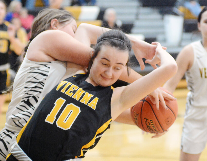 Reese Snodgrass (center) has the basketball taken from her Monday night during road basketball action in Morgan County between Vienna&rsquo;s Lady Eagles and Versailles Lady Tigers. KC Curler&rsquo;s Lady Eagles enter 2024 winners of their last three. games.