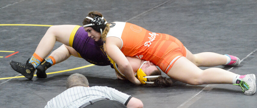 Madison Lewis (orange singlet) goes for a pin during her match at 190 pounds against Potosi back on Thursday, Dec. 14 at Sullivan High School.