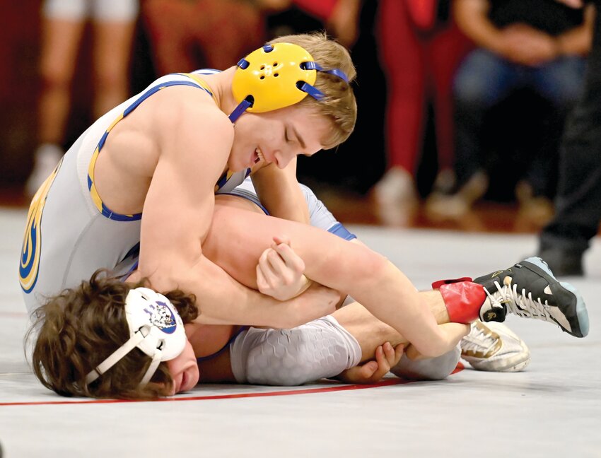 Fatima senior Cody Strope (126), is the first Comet to individually win his district four years in a row; he&rsquo;s shown pressuring California&rsquo;s Patrick Morrow in the title match.