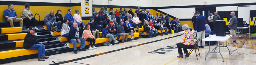Participants in the Maries County Republican Presidential Caucus listen as Maries County Republican Party Chairman Andrew Barr explains caucus procedures. The caucus, hosted last Saturday in the Vienna High School gym, had 58 participants.