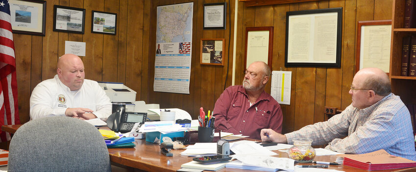 State Rep. Bennie Cook (left) speaks with Maries County Eastern District Commissioner Doug Drewel and Presiding Commissioner Victor Stratman during the March 11 Maries County Commission meeting.
