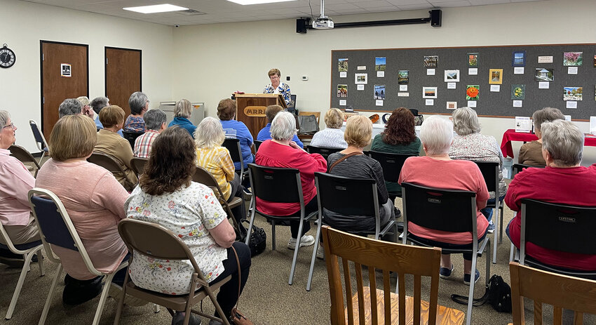 Osage County Historical Society Mary Zeilman, above, and Julie Allen, below speak to about 50 people at last week&rsquo;s Infamous Women of Osage County presentation at the Osage County Library.