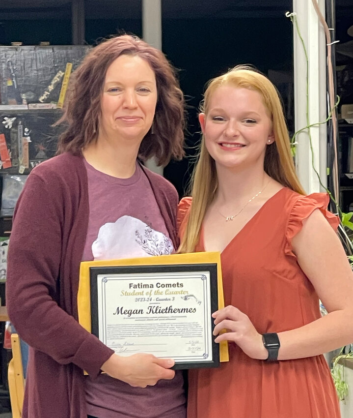 High school Student of the Month Megan Kliethermes receives award from Mrs. Erica Libbert.