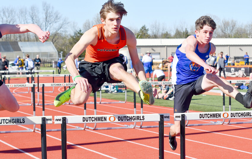 Jordan Bialczyk (center) competes in the second heat of the boys 110-meter hurdles during Friday&rsquo;s OHS Relays at Dutchmen Field.