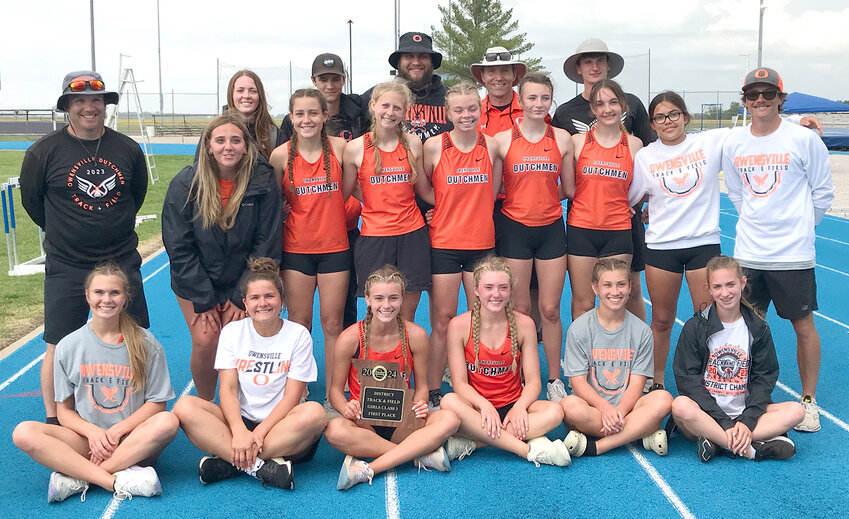 Owensville Dutchgirl track and field team members and coaches gather on the track at Montgomery County High School following their second consecutive district title after topping the field by nearly 40 points. OHS will look to keep the momentum going into Saturday&rsquo;s sectional track meet at Paris High School.