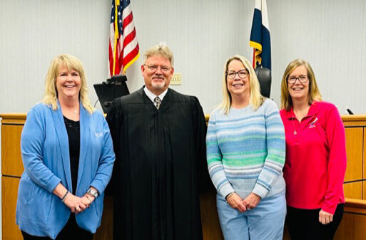 New Court Appointed Special Advocates (CASA) known as the “Sister Squad” pictured left to right, are sisters Collette Walker, Mary Light and Diane Curtis with the 25th Judicial Associate Judge Mark Calvert.