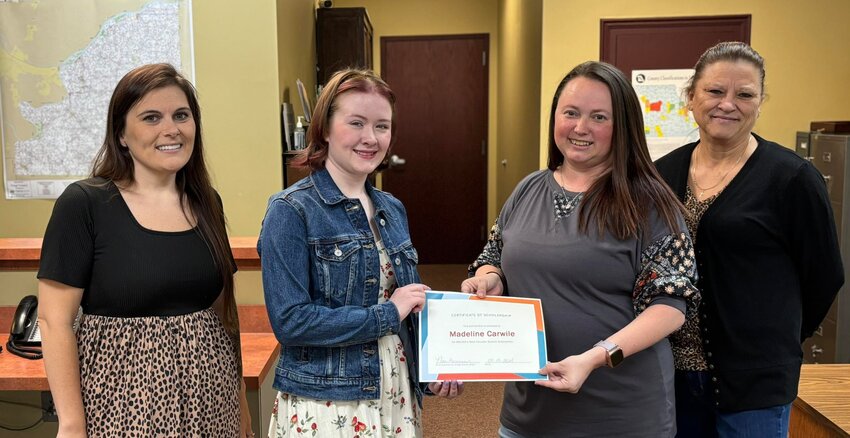 Pictured from left to right is Scholarship Committee Co-Chairman Brooke Dudenhoeffer, Madeline Carwile (recipient), County Clerk Nicci Kammerich, and Scholarship Committee Chairman Juanita Libbert.