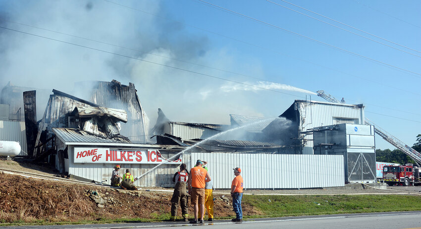 Firefighters from several area departments joined forces to fight a fire last Wednesday at Hilke’s Ice Co., in Freeburg.
