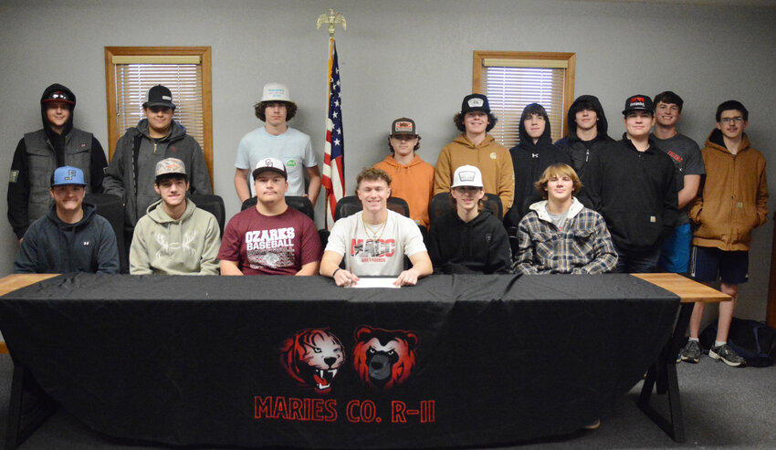 Blake Henry (center) signed his letter of intent to play college baseball at Moberly Area Community College.