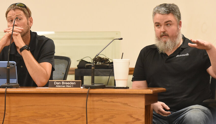 Owensville Ward 1 Alderman Danny Breeden (right) explains his opposition July 31 to asking voters to approve a sales tax to fund fire department services during the city’s special meeting. Looking on during Breeden’s discussion with members of the Owensville Volunteer Fire Department command staff and firefighters is Ward 2 Alderman Matt Kramme.