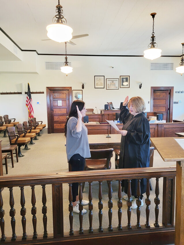 Brooke Dudenhoeffer is sworn in as the interim county clerk by Judge
Sonya Brandt on Monday after her appointment by commissioners.
Dudenhoeffer worked for resigning County Clerk Nicci Kammerich for
four years, and has plenty of experience in the office. Watch for a detailed
story on Dudenhoeffer next week.